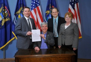 Sen. Pavlov, Gov. Snyder, and Rep. McMillin celebrate the passage of SB 618 uncapping charter schools in Michigan